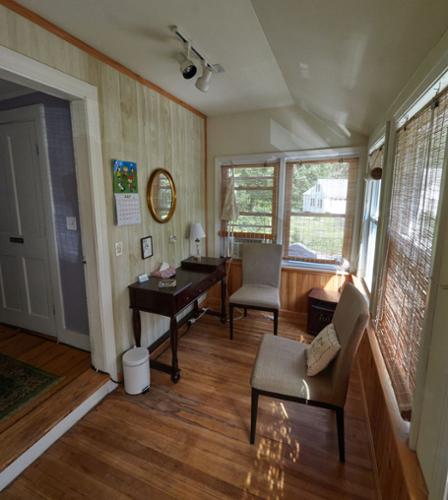 This closed in Porch has double glazed large window and serve as a Room for Massage Therapy and Skin Care and Facials
